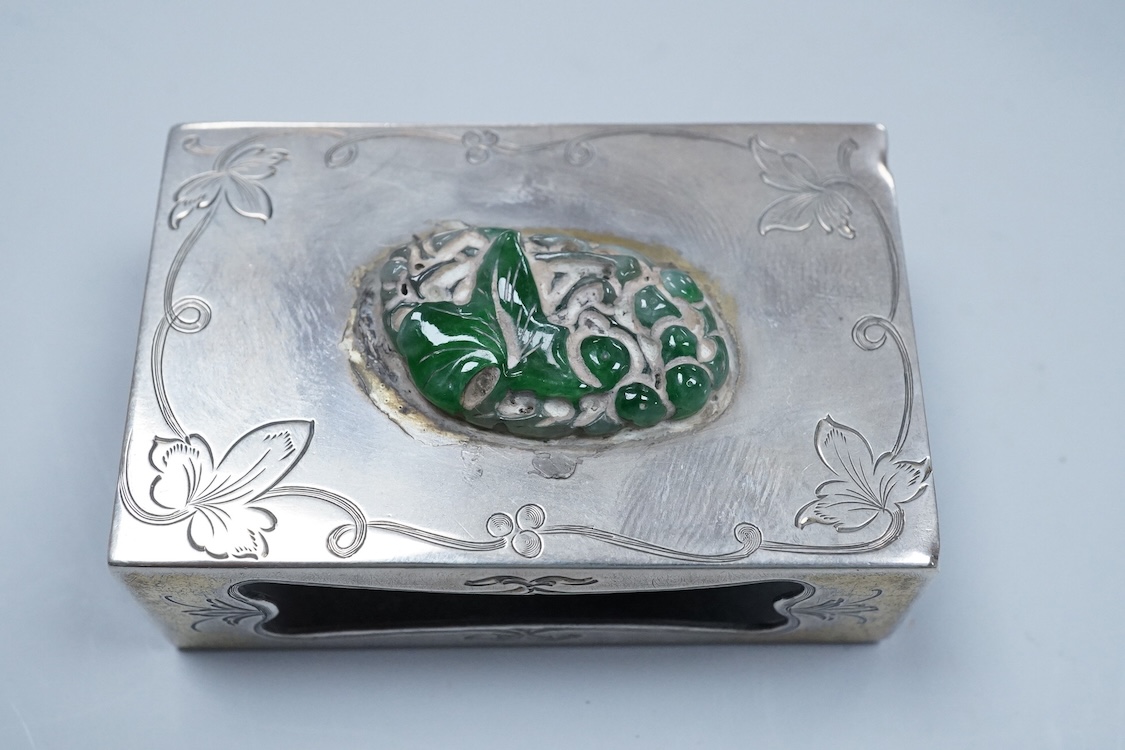 Two North American Edward I. Farmer of New York engraved sterling matchbox slides, one mounted with a jadeite carving, the other with polychrome enamelled surmount, both approximately 60mm.
